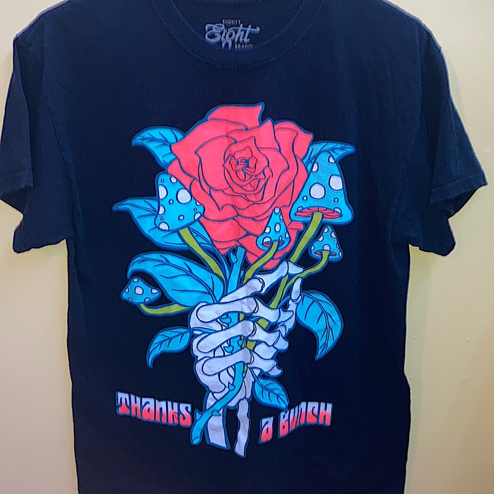 Black T-shirt with with a red rose and blue mushrooms,